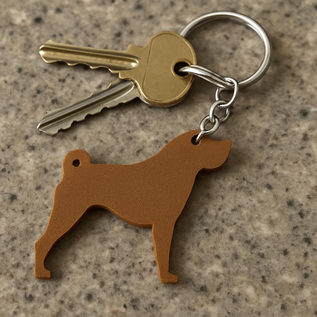 Keychain with dog-shaped key holder on a textured surface