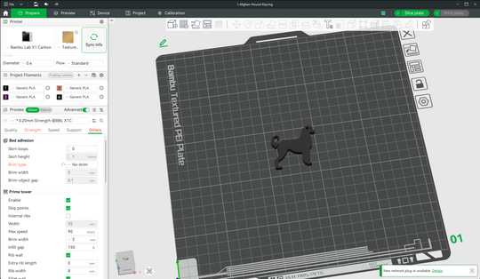 Afghan Hound keyring STL file shown loaded in Bambu Studio slicer on a textured PEI build plate for 3D printing.