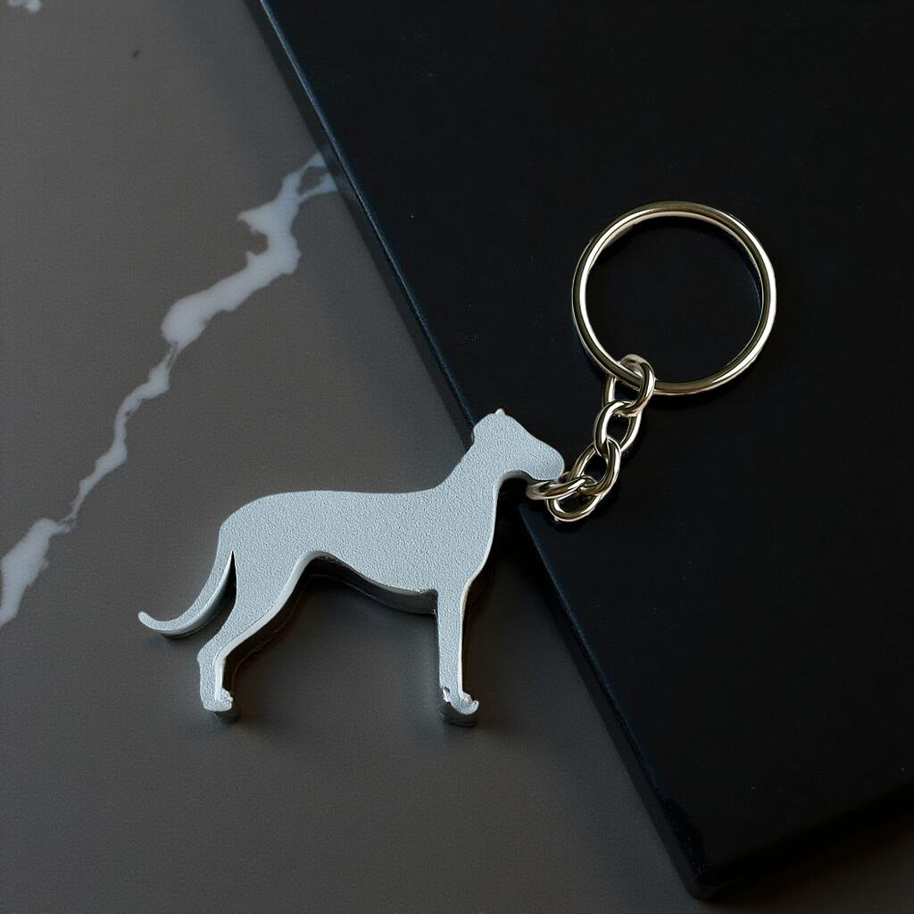Dog-shaped keychain on a black surface