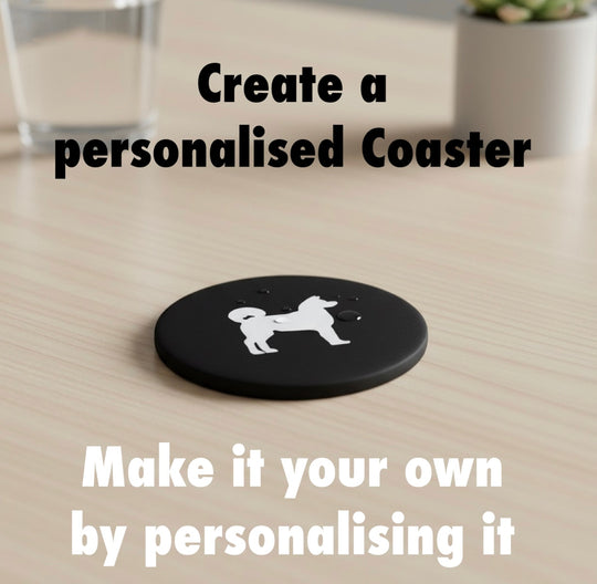 Akita 3D Printed Dog Coaster. Black coaster with a Akita dog  on a wooden surface, text promoting personalization.