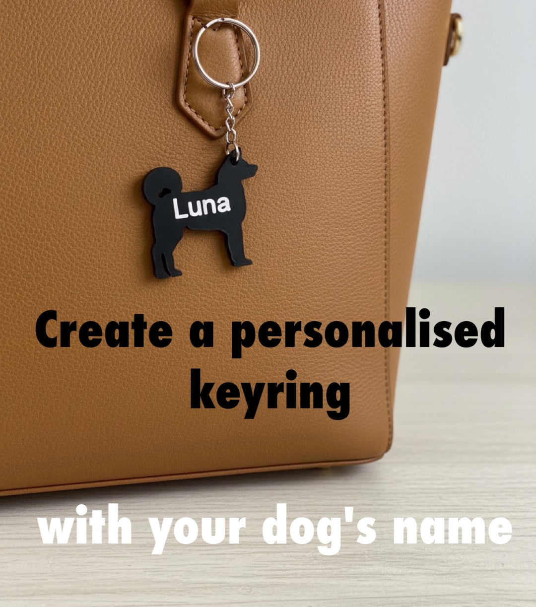 Akita 3D Printed Dog Keyring Keychain with Akita dog and 'Luna' text attached to a brown bag, with text promoting personalized keyrings.