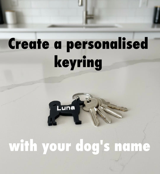 Akita 3D Printed Dog Keyring. Keyring with 'Luna' engraved on it on a kitchen counter.