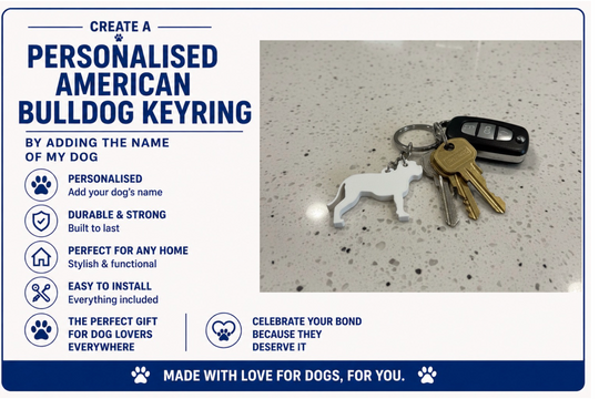 Personalised American Bulldog keyring with keys on a speckled surface