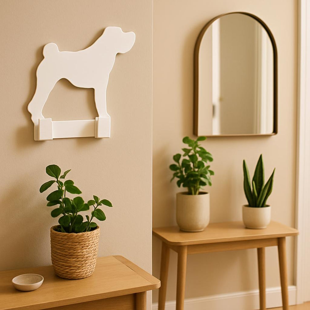 Decorative wall shelf shaped like a dog, mirror, and potted plants on a wooden table and side table.
