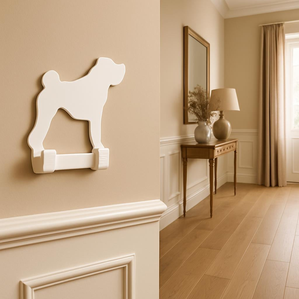 Decorative wall hook shaped like a dog on a beige wall with a hallway in the background.