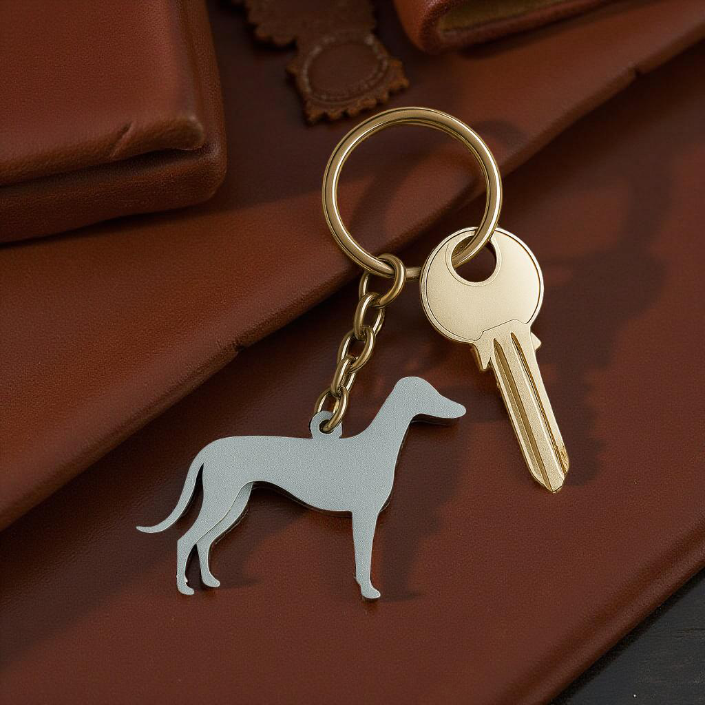 Keychain with a dog-shaped charm and a key on a brown surface