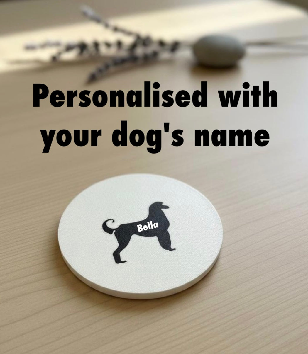 Afghan Hound dog coaster STL file with custom name Bella on round coaster, example personalised 3D printed design on wooden table
