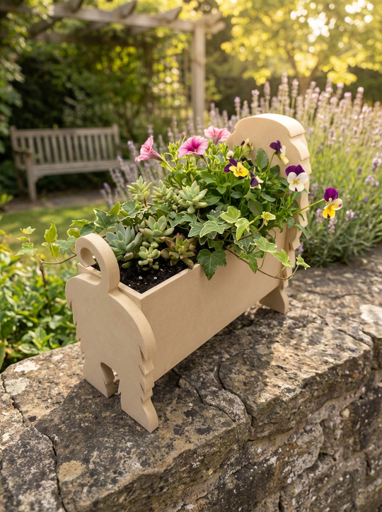 Personalised 3D-printed Afghan Hound dog planter filled with flowers, displayed outdoors on a stone wall in a sunny garden setting.