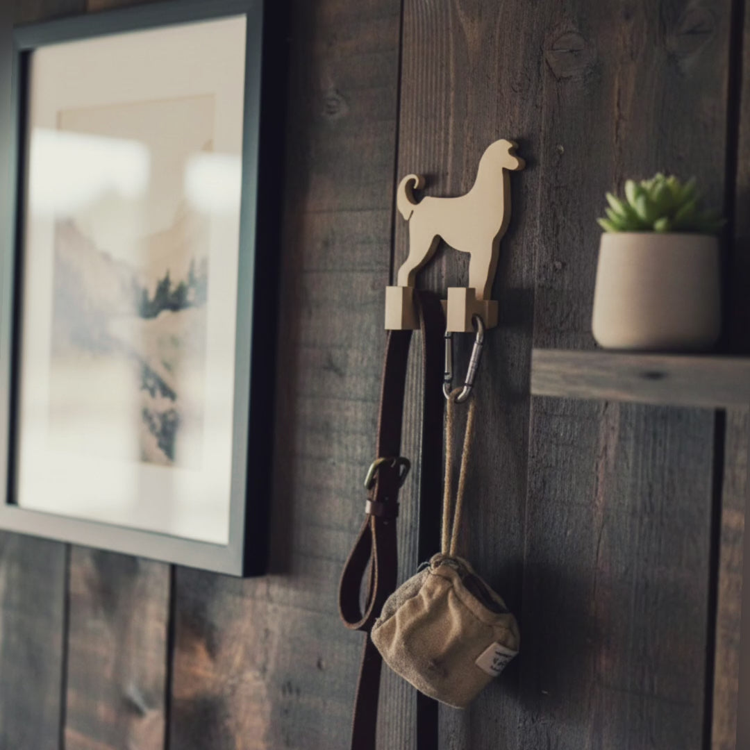 Video slideshow showing multiple views of a 3D printed Afghan Hound dog wall hook, including hallway installation, rustic wooden wall styling, close ups, and 3D printing software previews.